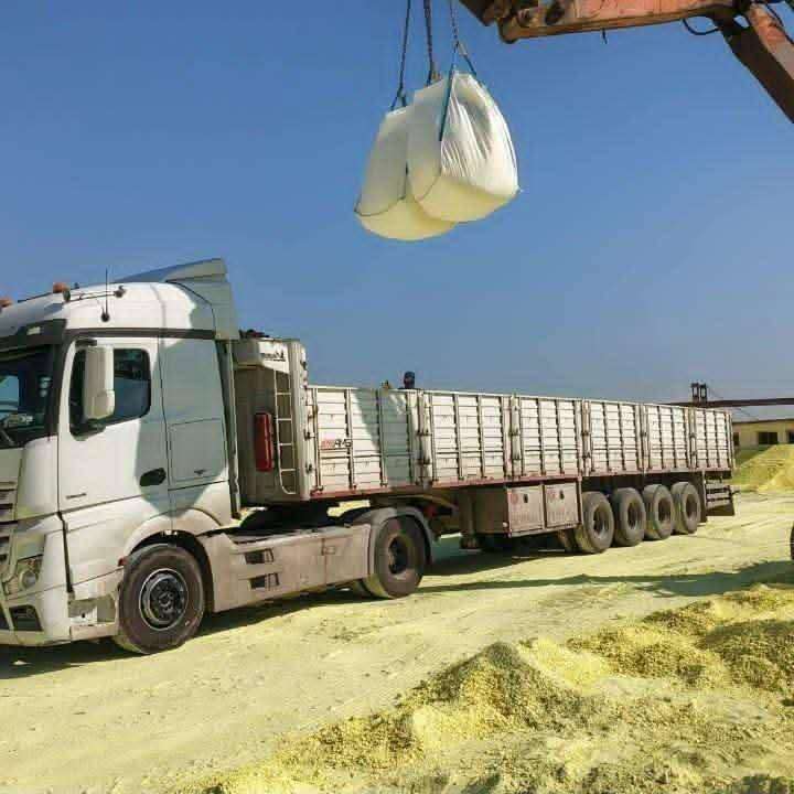 Truck loading sulfur at yard